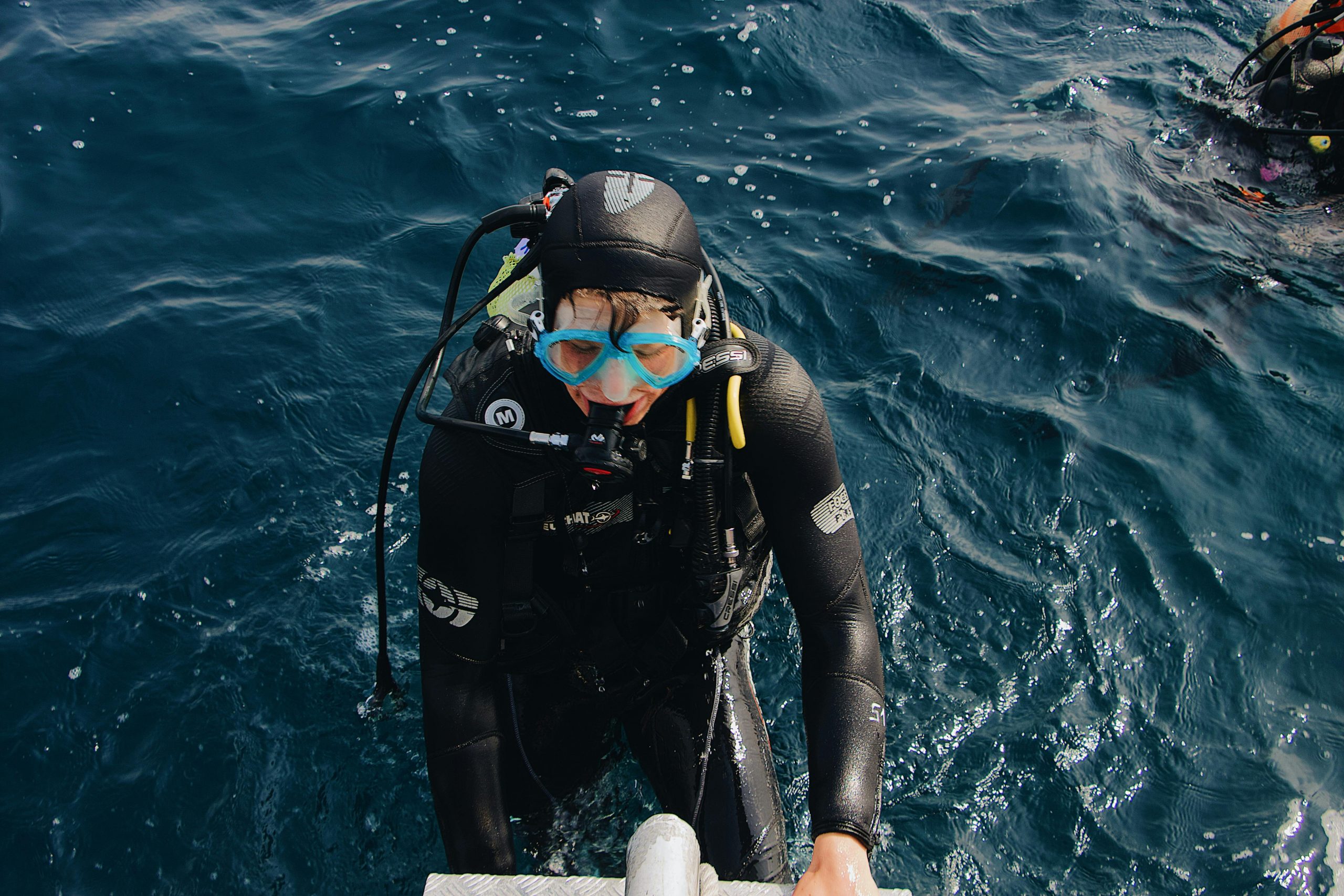 Solo diver gearing up on a liveaboard deck