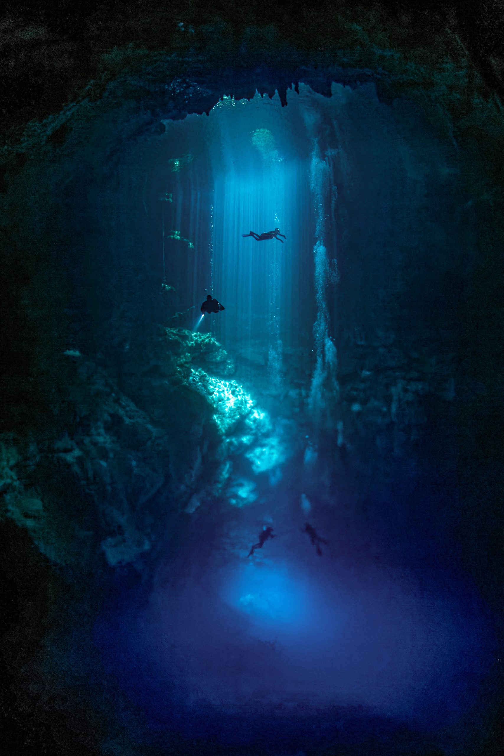 El Pit cenote light shafts