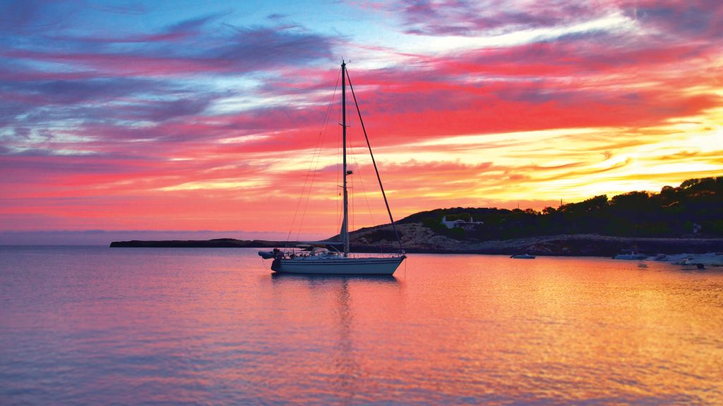 Tropical atoll and liveaboard boat from the water level