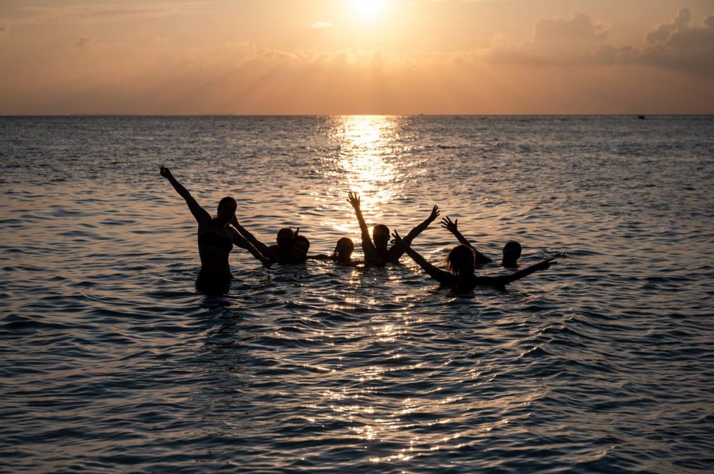 Group of divers on surface interval on liveaboard sundeck