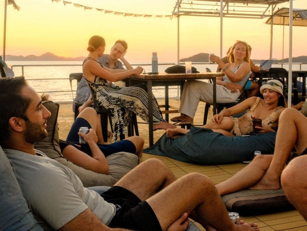 Divers relaxing on the sundeck of a liveaboard between dives at the Brothers Islands