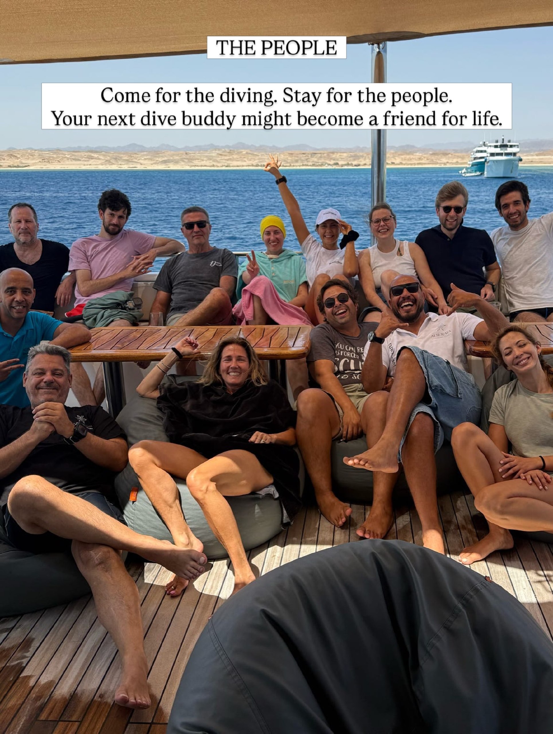 Group of divers relaxing together on the shaded deck of a liveaboard