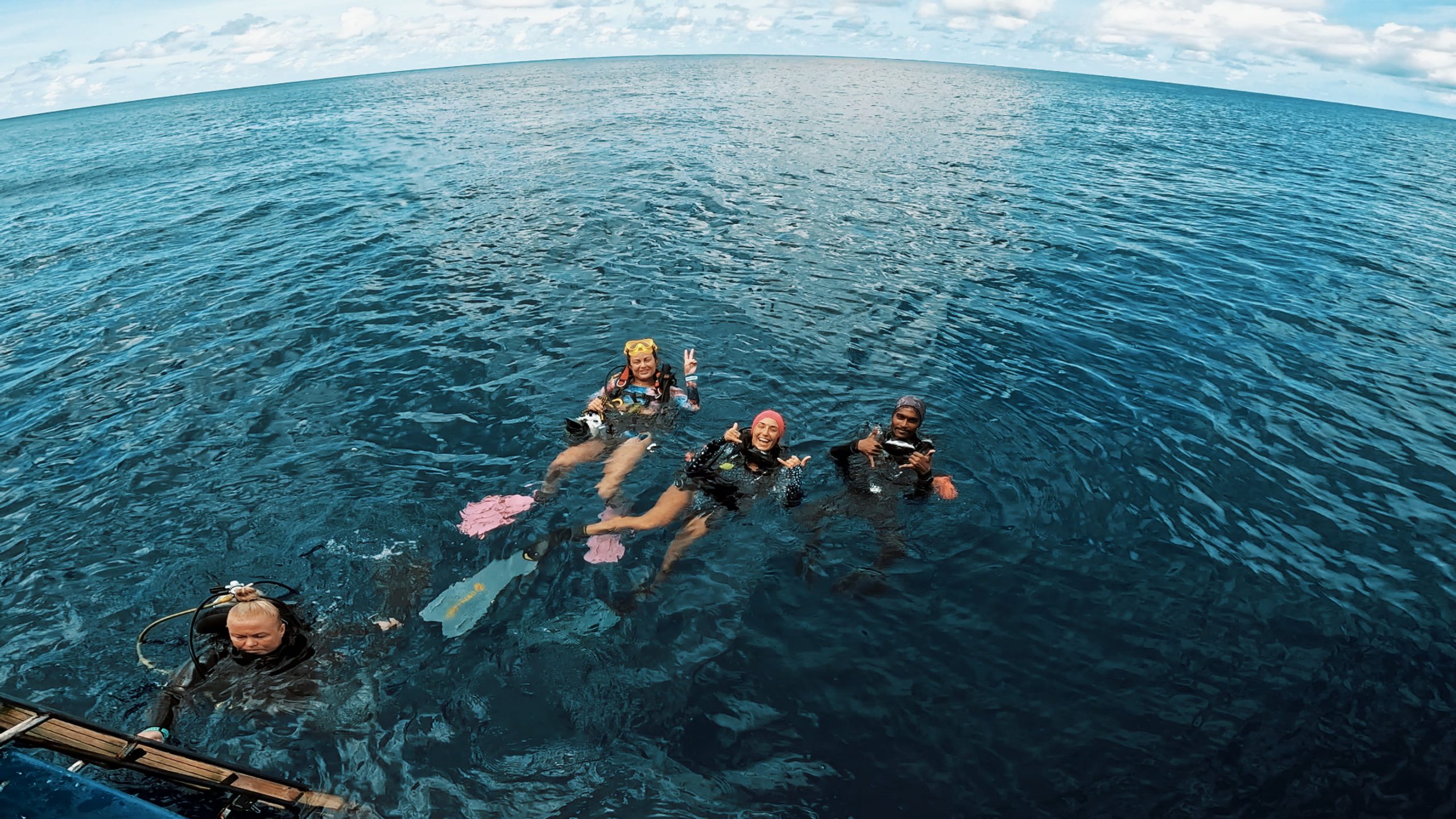 Divers on the surface between dives on a liveaboard trip