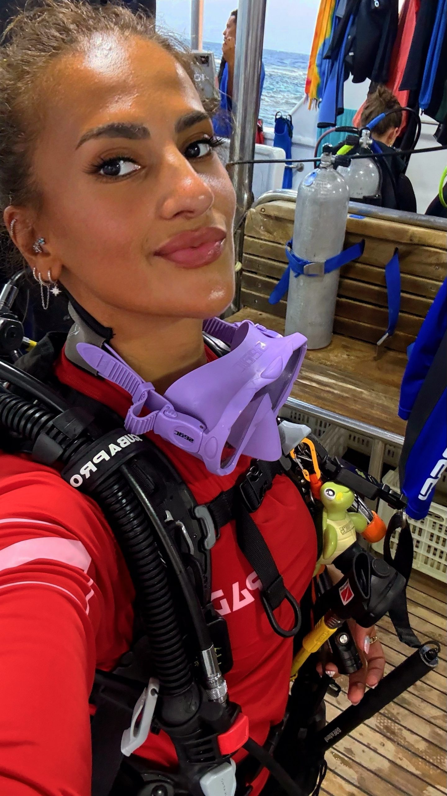 Diver suiting up with tanks on a Red Sea liveaboard, Egypt
