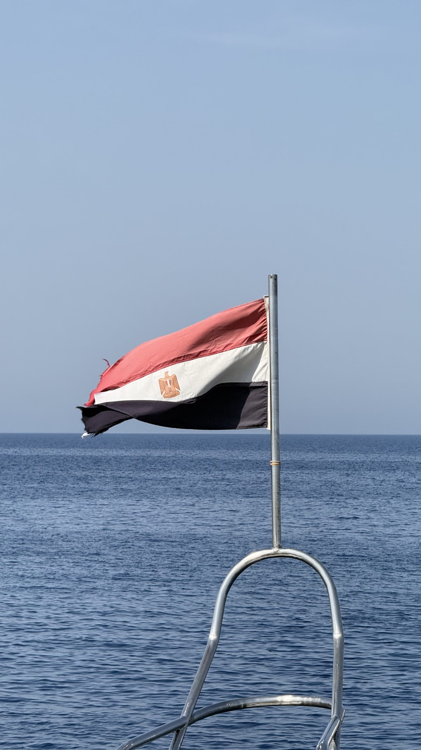 Egyptian flag flying from the stern of a Red Sea liveaboard