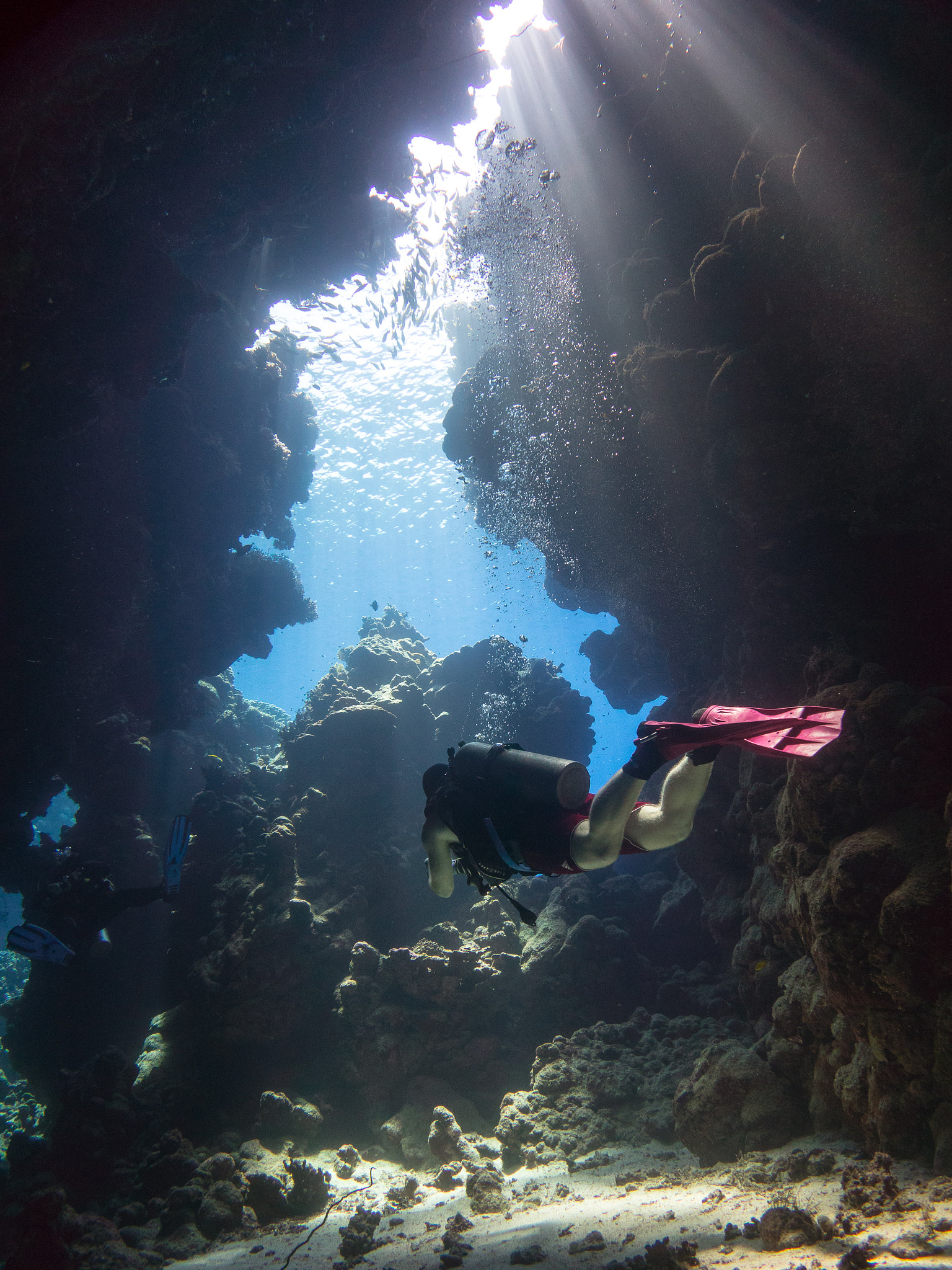 Diver in the cave system at St John's Reef, Red Sea, Egypt