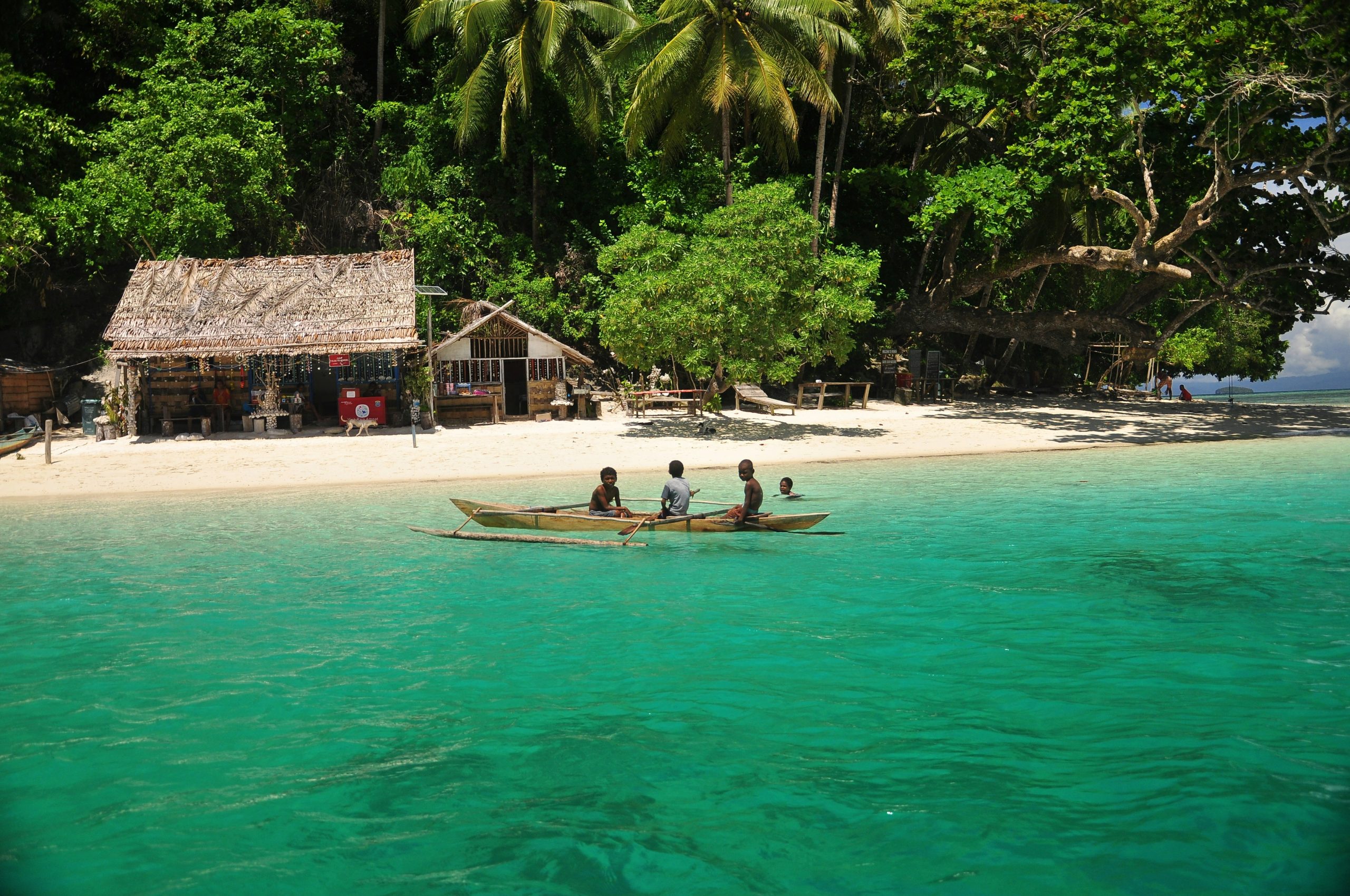 Divers on a small boat among the islands of Raja Ampat
