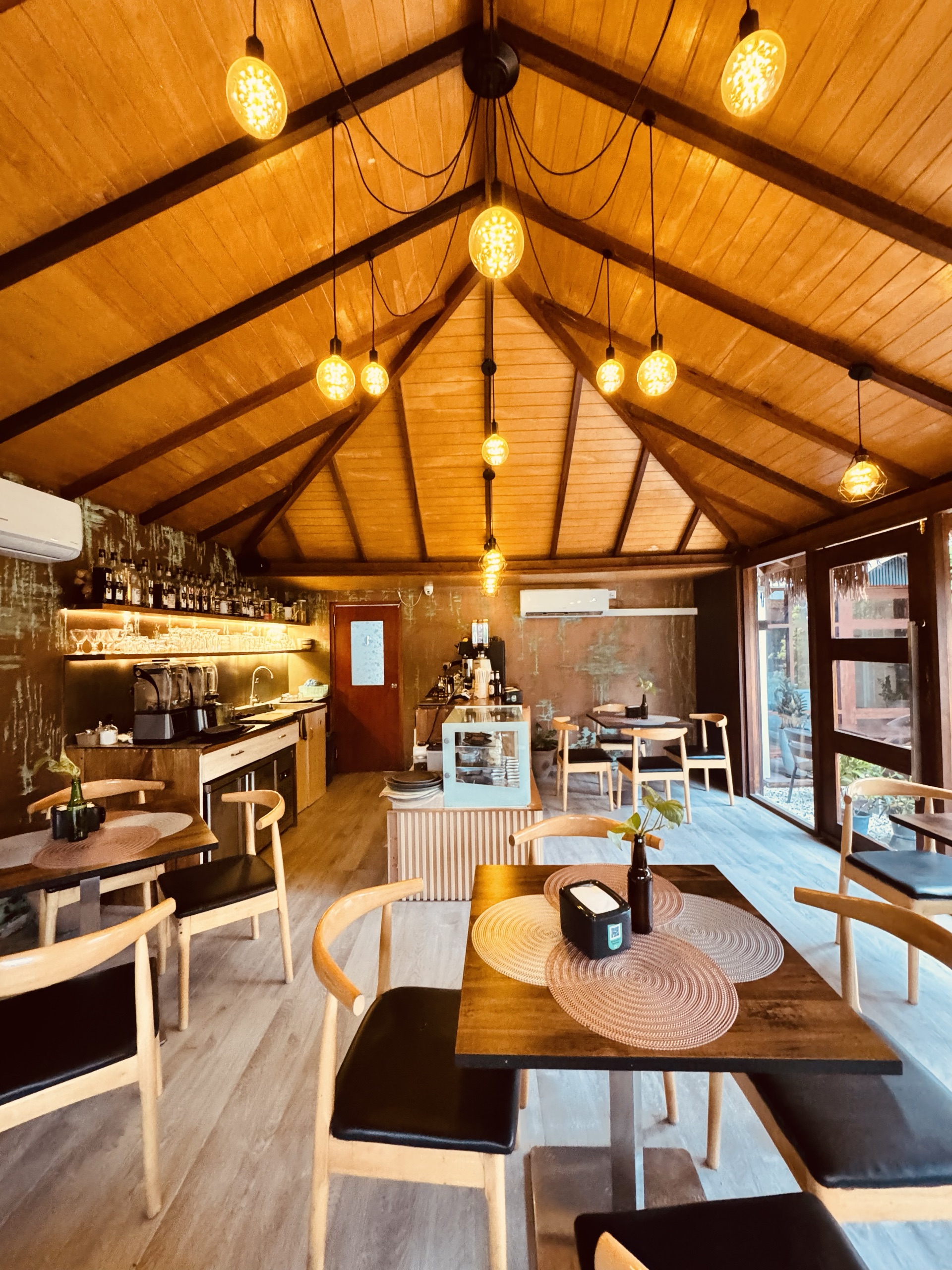 Wooden interior with pendant lights at Cafe Eden, Fuvahmulah
